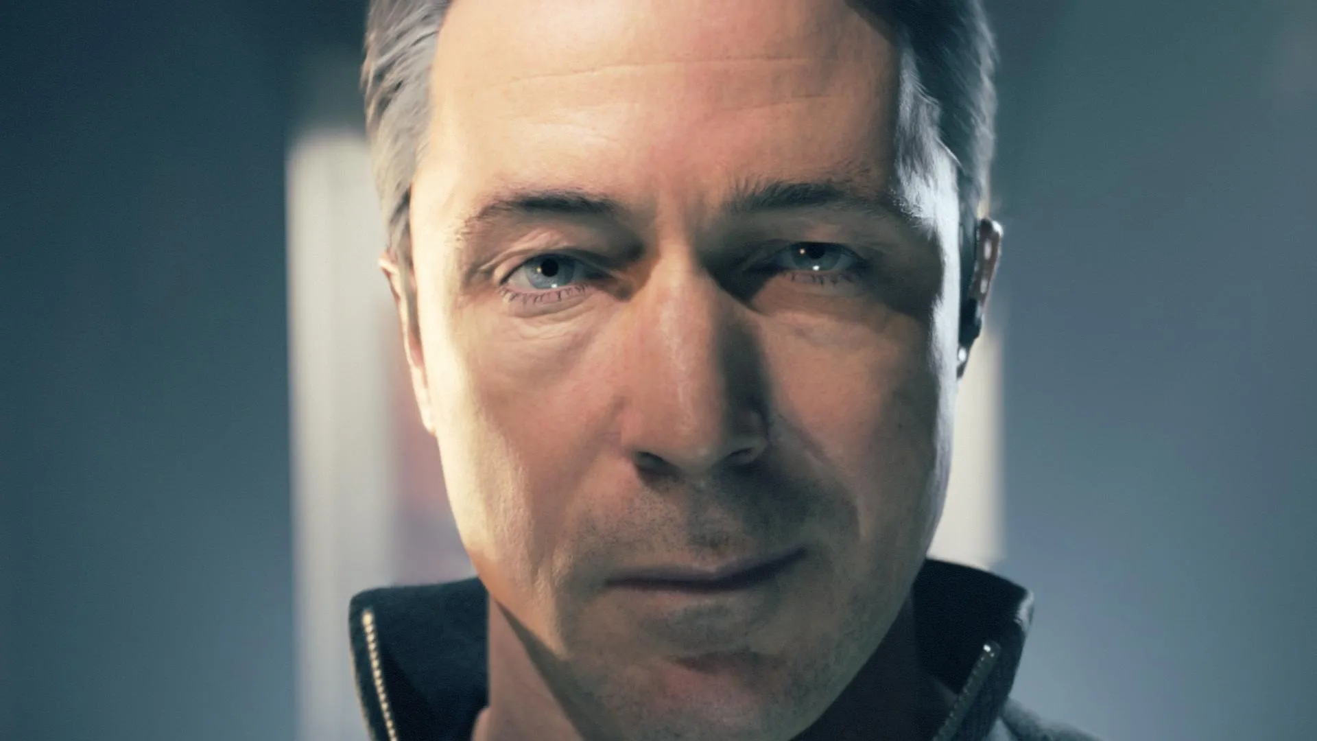 "Close-up view of Paul Serene from Quantum Break. A man with blue eyes, white skin and grey hair stares into the camera."